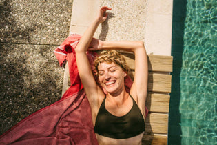 A woman sitting on the floor with smooth legs