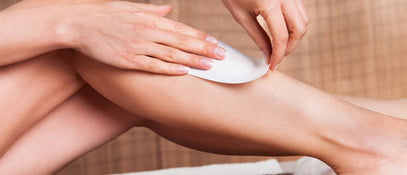 A person using a hair removal strip